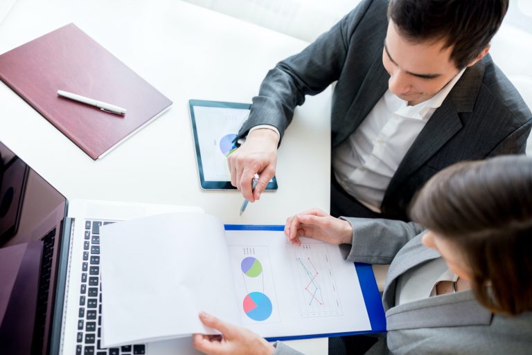 Business People Reviewing Business Documents